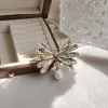 A golden crystal flower brooch is an elegant and retro accessory for women details Picture